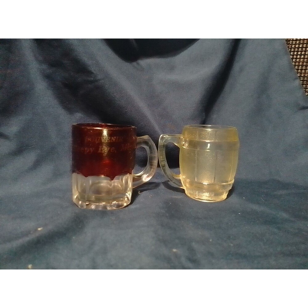 two vintage miniature glass mugs